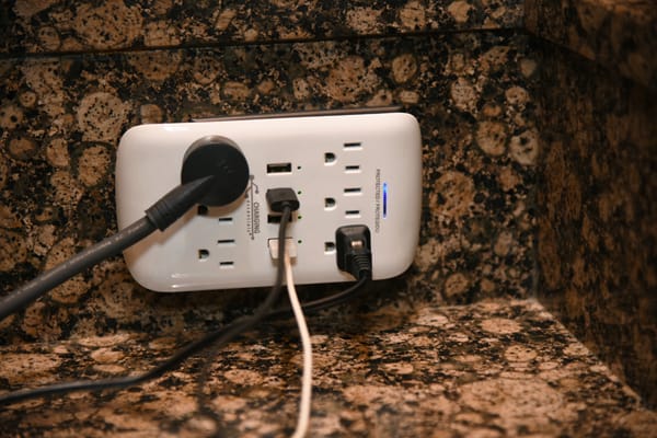 devices plugged into a wall surge protector