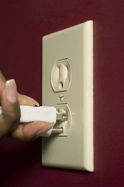 3-prong plug going into a 3-prong outlet