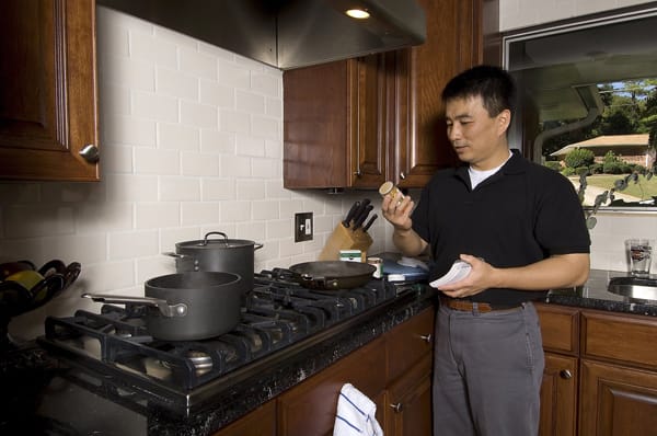 man looking at cooking ingredients