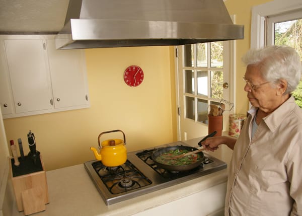 older woman cooking