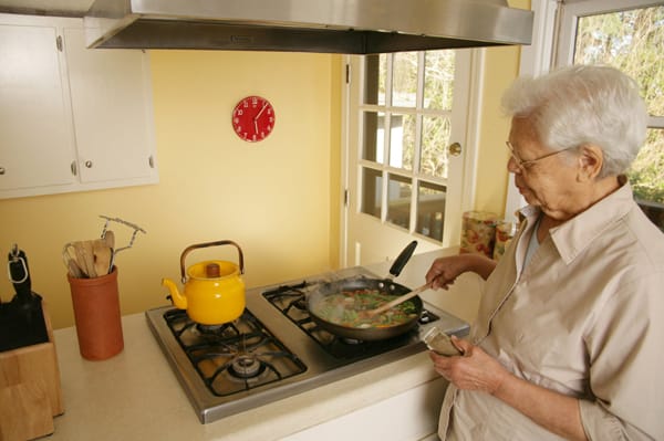 older woman cooking