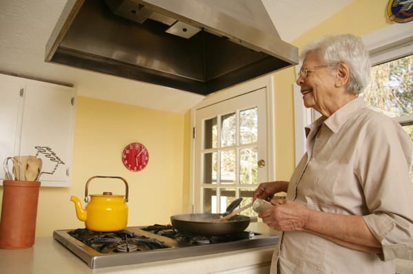 older woman cooking