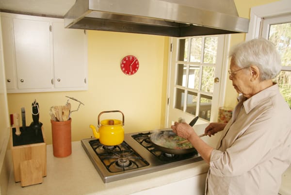 older woman cooking