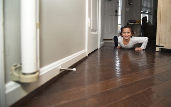 girl practicing crawling low under smoke