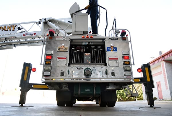 firefighter operating a ladder truck