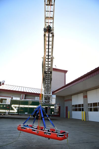 ladder truck raising a stretcher