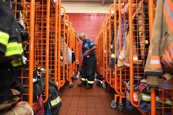 firefighter putting on bunker gear