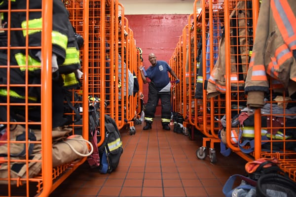 firefighter putting on bunker gear