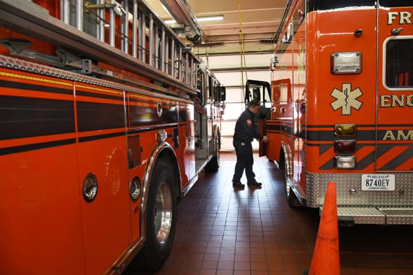 firefighter and appartus inside station