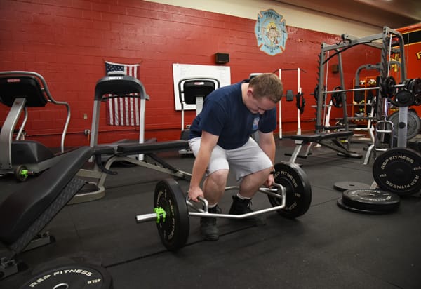 firefighter lifting weights
