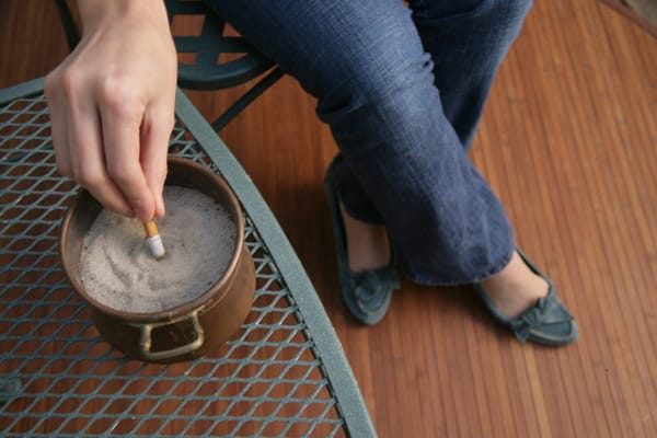 extinguishing a cigarette in sand