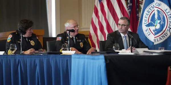 Chief Donna Black (IAFC), Chief Kevin Quinn (NVFC) and Edward Kelly (IAFF) converse at the national roundtable.
