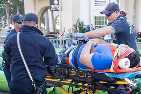 EMTs attending a patient on a stretcher