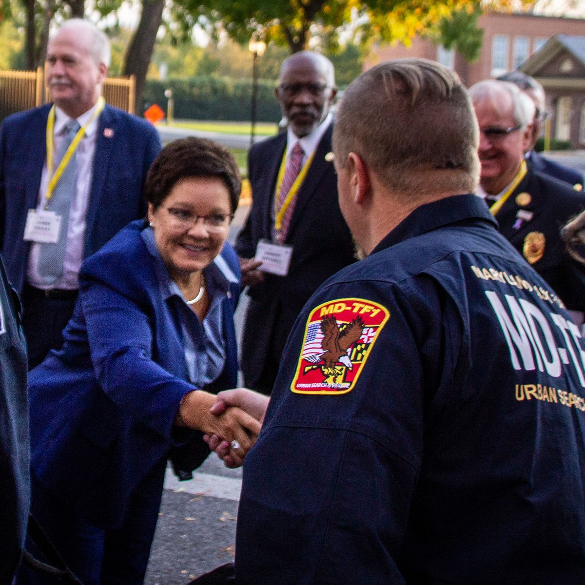 Photo of Dr. Lori Moore-Merrell meeting an urban search and rescue team.
