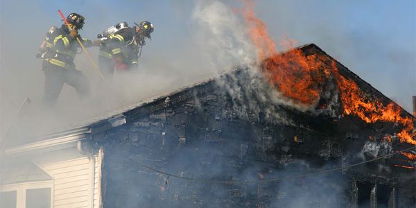 Photo of firefighters battling a residential fire