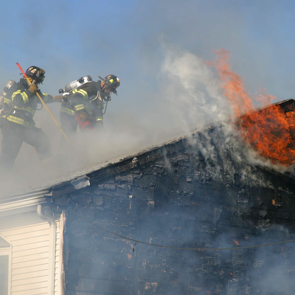 Photo of firefighters battling a residential fire