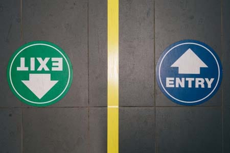 entry and exit stickers on a floor