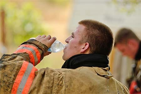 firefighter drinking water