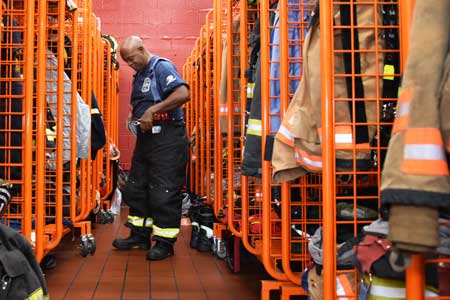 firefighter putting on gear