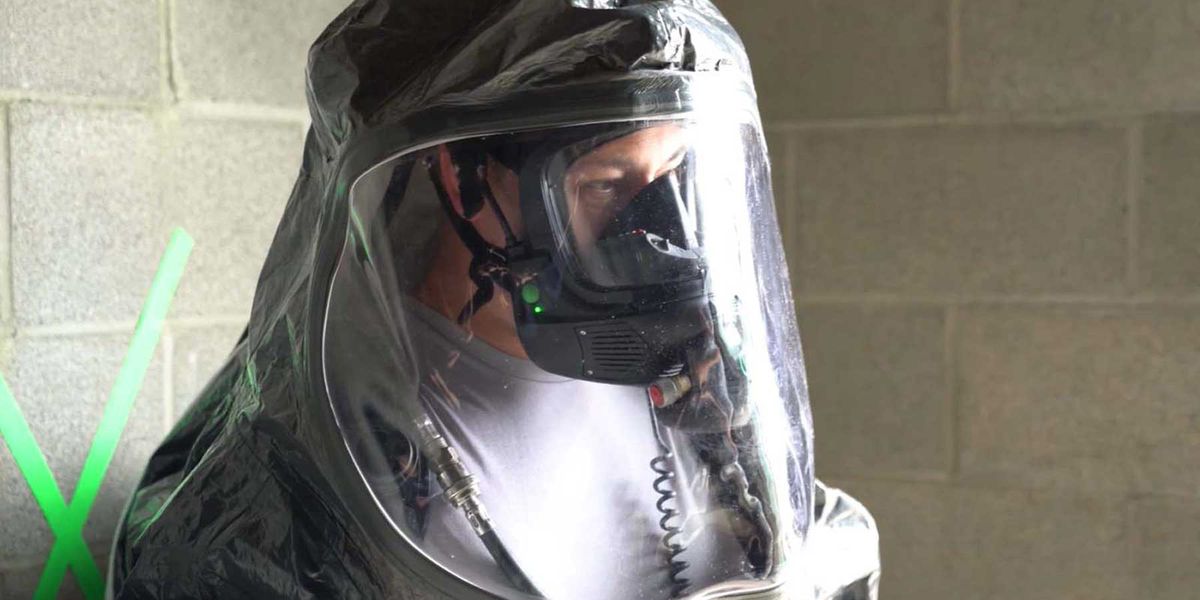 Photo of firefighter putting on gear