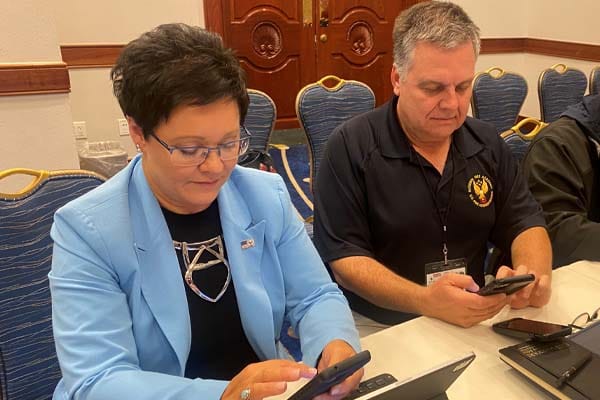 Dr. Lori Moore-Merrell and NFA superintendent Eriks Gabliks test registering for the NFR.