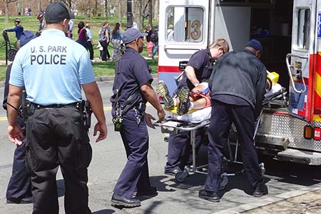 paramedics placing a patient into an ambulance