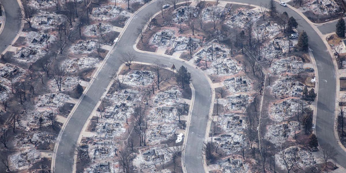 Photo of a community destroyed by a wildland fire.