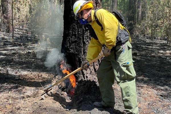 wildland firefighter wearing respirator