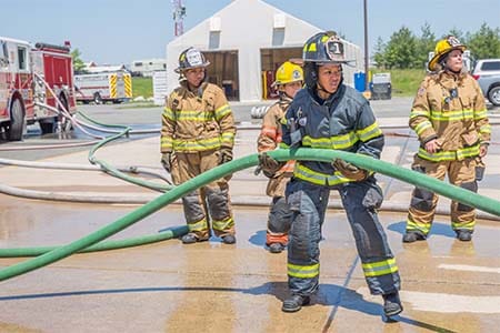 female firefighters on hoseline during a training drill